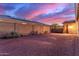 Large, private backyard with block fencing and desert landscaping is ideal for outdoor living at 19873 W San Juan Ave, Litchfield Park, AZ 85340