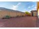 Private backyard with desert landscaping and secure fencing offers a serene outdoor living space at 19873 W San Juan Ave, Litchfield Park, AZ 85340