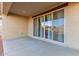 Backyard patio with sliding glass doors opens to an ample backyard, creating seamless indoor-outdoor living at 19873 W San Juan Ave, Litchfield Park, AZ 85340