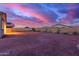 Fully fenced backyard with desert landscaping, offering a private and serene outdoor space at 19873 W San Juan Ave, Litchfield Park, AZ 85340