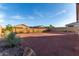 Expansive backyard features desert landscaping, offering a blank canvas for your outdoor dreams at 19873 W San Juan Ave, Litchfield Park, AZ 85340