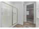 Bathroom with a glass enclosed shower and grey toned tile flooring at 19873 W San Juan Ave, Litchfield Park, AZ 85340