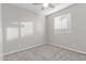 Bright bedroom with a ceiling fan and natural light from a window with adjustable blinds at 19873 W San Juan Ave, Litchfield Park, AZ 85340