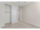Bedroom featuring an adjacent closet with sliding doors at 19873 W San Juan Ave, Litchfield Park, AZ 85340