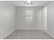 Neutral-toned bedroom featuring a ceiling fan and a window with blinds at 19873 W San Juan Ave, Litchfield Park, AZ 85340