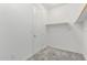 Bright walk-in closet with shelving and a clothing rod at 19873 W San Juan Ave, Litchfield Park, AZ 85340