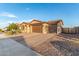 Attractive single-story desert home with 3-car garage, pavers, and desert landscaping at 19873 W San Juan Ave, Litchfield Park, AZ 85340