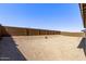 Spacious backyard featuring a block wall providing privacy and ample space for landscaping at 20274 W Monterey Way, Buckeye, AZ 85396