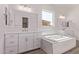 Bright bathroom with soaking tub and dual sink vanity at 20274 W Monterey Way, Buckeye, AZ 85396