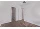 Bedroom showcasing a neutral color scheme, two doors, and carpeted flooring at 20274 W Monterey Way, Buckeye, AZ 85396