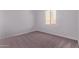 Neutral bedroom with one window and neutral carpet at 20274 W Monterey Way, Buckeye, AZ 85396