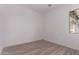 Bedroom with a window, neutral flooring, and bright white walls at 20274 W Monterey Way, Buckeye, AZ 85396