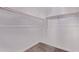 Walk-in closet features wooden hanging rails and carpeted flooring at 20274 W Monterey Way, Buckeye, AZ 85396