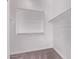 Walk-in closet with white shelving and hanging rods at 20274 W Monterey Way, Buckeye, AZ 85396