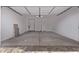 A spacious two-car garage with a bright interior and smooth concrete floor at 20274 W Monterey Way, Buckeye, AZ 85396