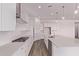 Bright kitchen featuring white cabinets, stainless steel appliances, a subway tile backsplash, and a spacious island at 20274 W Monterey Way, Buckeye, AZ 85396