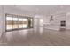 Open living space featuring wood-look tile floors, sliding glass doors, recessed lighting, and a modern kitchen at 20274 W Monterey Way, Buckeye, AZ 85396