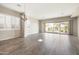 Bright dining room featuring shuttered windows, chandelier and sliding glass doors to the backyard at 20473 W Legend Trl, Buckeye, AZ 85396
