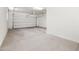 Spacious two-car garage with white walls and a clean concrete floor at 20473 W Legend Trl, Buckeye, AZ 85396