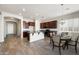 Eat-in kitchen with dark wood cabinets, stainless steel appliances and an adjacent dining area at 20473 W Legend Trl, Buckeye, AZ 85396