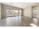 Bright living room with sliding glass doors leading to the backyard, creating an indoor/outdoor flow at 20473 W Legend Trl, Buckeye, AZ 85396