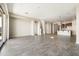 Open-concept living room with tile flooring, neutral walls, and abundant natural light creating a bright, airy space at 20473 W Legend Trl, Buckeye, AZ 85396