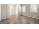 Bright living room with tile floors and large windows offering natural light, creating a warm and inviting space at 20473 W Legend Trl, Buckeye, AZ 85396