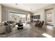 Bright living room with large windows, comfortable seating, and a view of the outdoor space at 20473 W Legend Trl, Buckeye, AZ 85396