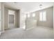 Upstairs landing area with carpet flooring and a view of the upstairs hallway at 20473 W Legend Trl, Buckeye, AZ 85396