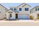 Charming two-story home featuring a two-car garage, neutral-toned exterior, and minimalist landscaping at 2205 N Peden Dr, Chandler, AZ 85225