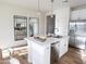 Modern kitchen featuring a kitchen island with sink, stainless appliances, and sleek, white cabinets at 2205 N Peden Dr, Chandler, AZ 85225