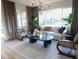 Bright living room featuring large windows, stylish furniture, hardwood flooring, and modern decor at 2205 N Peden Dr, Chandler, AZ 85225