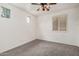 Bedroom featuring carpet, ceiling fan, and windows with shutters at 2308 S Bernard --, Mesa, AZ 85209