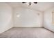 Neutral-toned bedroom featuring carpet, vaulted ceiling, and shuttered windows at 2308 S Bernard --, Mesa, AZ 85209