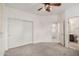 Neutral bedroom features a ceiling fan, carpeted floors, and a walk-in closet at 2308 S Bernard --, Mesa, AZ 85209