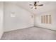 Bedroom with carpet, ceiling fan, and shuttered windows at 2308 S Bernard --, Mesa, AZ 85209