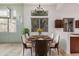 Charming dining room with ample seating, large windows, and sleek modern design elements at 2308 S Bernard --, Mesa, AZ 85209