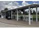 Golf driving range features multiple bays with seating, shade, and TVs for added convenience at 2308 S Bernard --, Mesa, AZ 85209