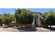 Exterior view showcasing the home's architectural style, mature trees, and well-maintained landscaping at 2308 S Bernard --, Mesa, AZ 85209