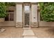 Charming single story home featuring a decorative steel front door and stone accents at 2308 S Bernard --, Mesa, AZ 85209