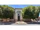 Charming two-story home featuring a stucco facade, decorative front door, and mature shade trees at 2308 S Bernard --, Mesa, AZ 85209