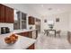 Well-lit kitchen with stainless steel appliances, dining area and outside view at 2308 S Bernard --, Mesa, AZ 85209