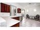 Open kitchen features white countertops, wood cabinets, stainless steel appliances, and eat-in area at 2308 S Bernard --, Mesa, AZ 85209