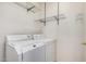 Laundry room featuring a washer, dryer, and wire racks for storage at 2308 S Bernard --, Mesa, AZ 85209