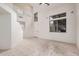 Bright and open living room boasting neutral tile floors, and large windows offering natural light at 2308 S Bernard --, Mesa, AZ 85209