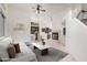 Bright living room featuring tile floors, a modern fireplace, and comfortable seating at 2308 S Bernard --, Mesa, AZ 85209