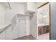 Walk-in closet leading into en suite bathroom at 2308 S Bernard --, Mesa, AZ 85209