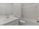 Clean bathroom featuring a shower-tub combination with white tiling, a toilet, and a sink at 23443 W Albeniz Pl, Buckeye, AZ 85326