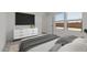 Comfortable main bedroom with modern furniture and a large window for ample natural light at 23443 W Albeniz Pl, Buckeye, AZ 85326