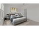 Stylish main bedroom with a plush bed, modern decor, and ample natural light at 23443 W Albeniz Pl, Buckeye, AZ 85326